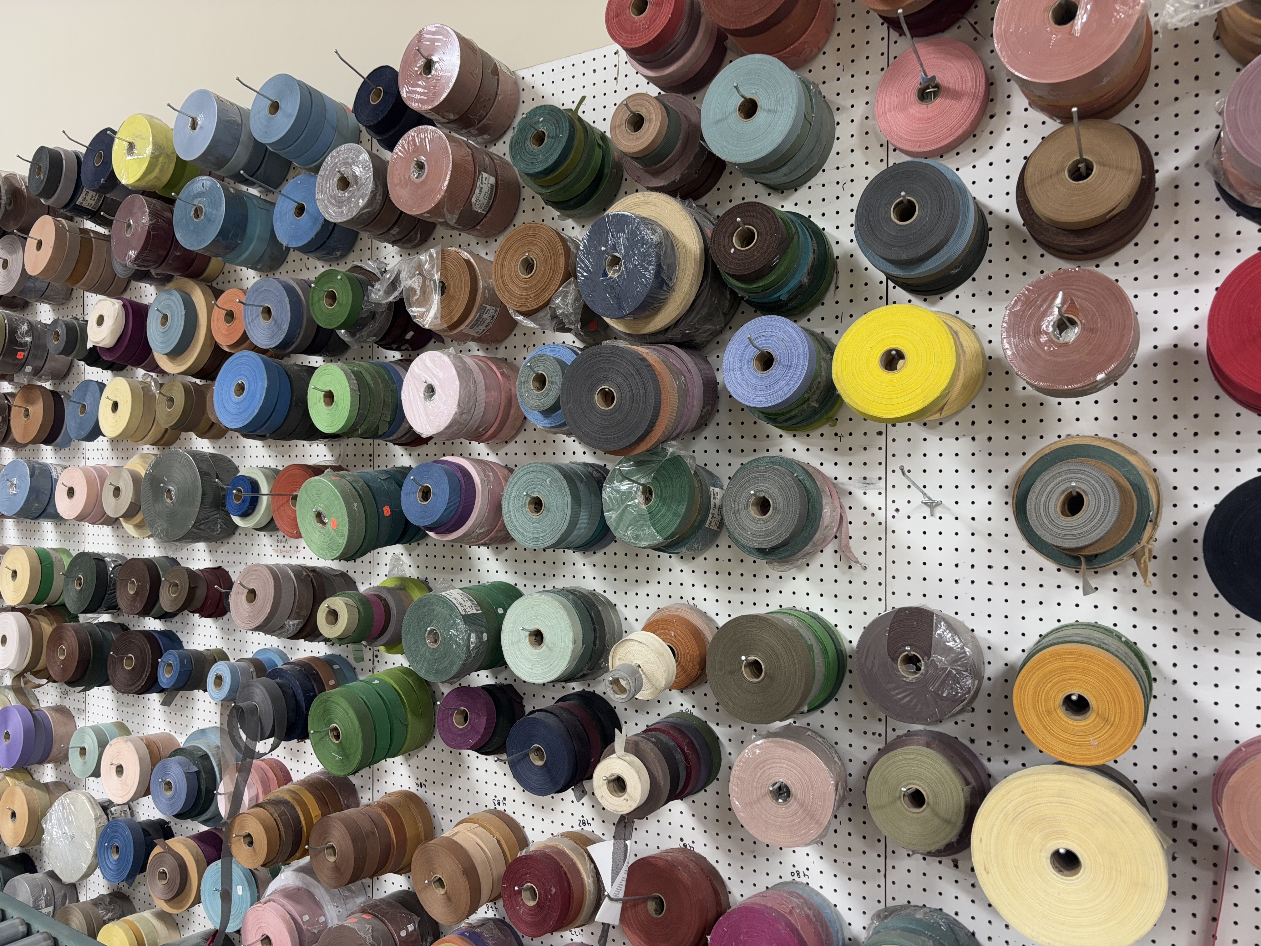 Carpet binding and serging supplies in Underfoot Design custom fabrication workroom Tucker GA